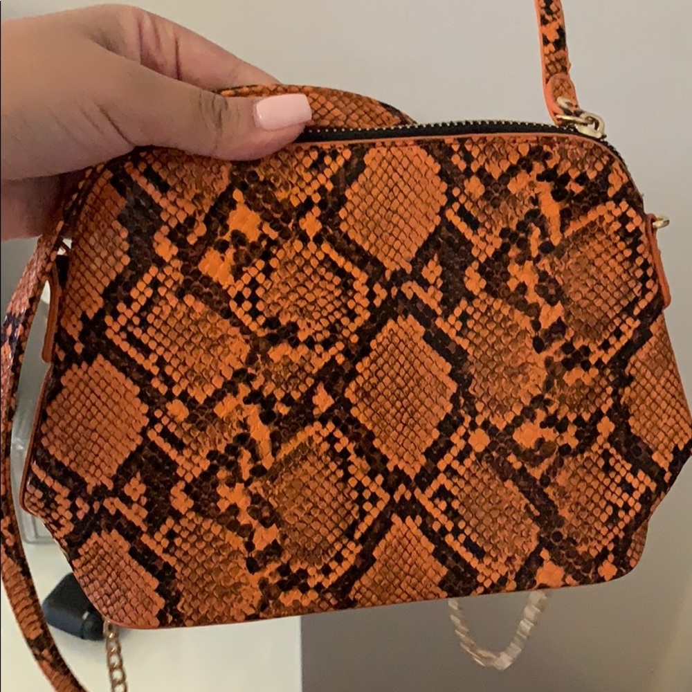 Orange snakeskin crossbody with gold chain!